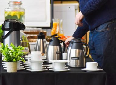 Person serving coffee