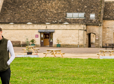 Two people walking across campus