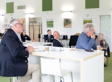 Seated delegates in a contemporary space